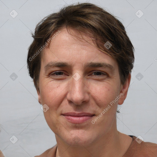 Joyful white adult female with short  brown hair and brown eyes