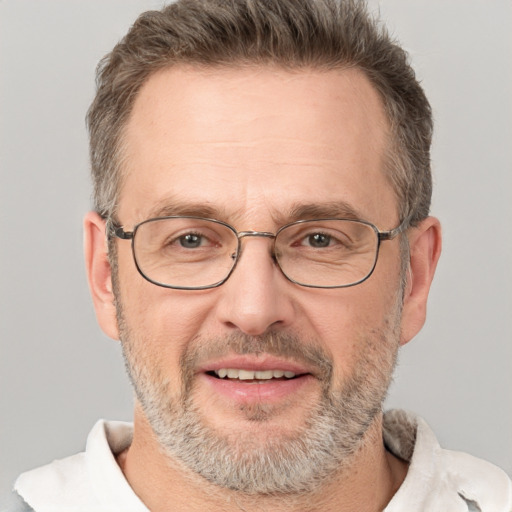 Joyful white middle-aged male with short  brown hair and brown eyes