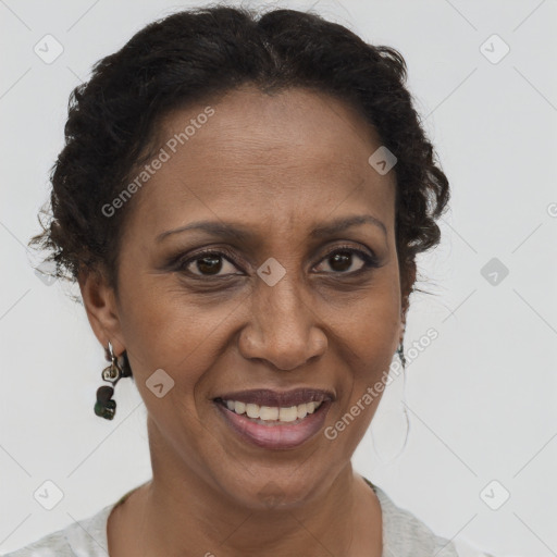 Joyful latino adult female with short  brown hair and brown eyes