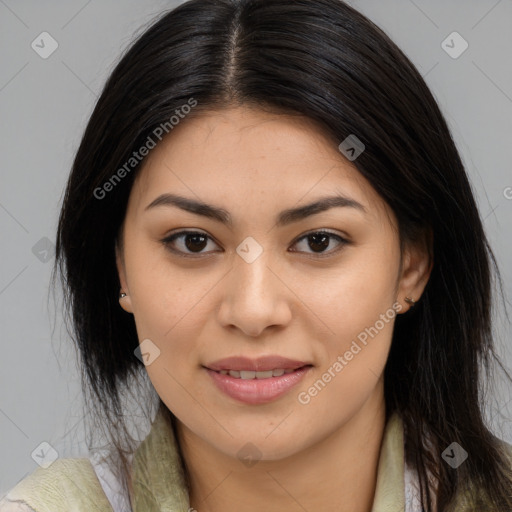 Joyful latino young-adult female with long  brown hair and brown eyes