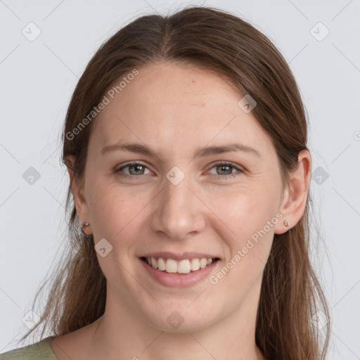 Joyful white young-adult female with long  brown hair and grey eyes