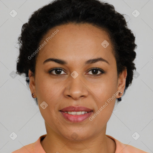 Joyful black young-adult female with short  brown hair and brown eyes