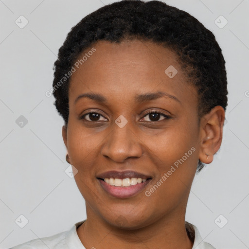 Joyful black young-adult female with short  black hair and brown eyes