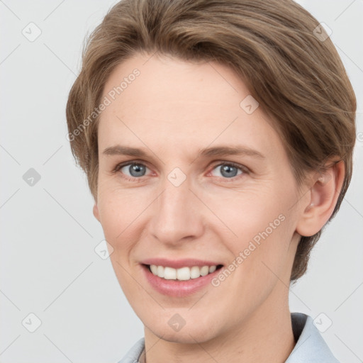 Joyful white young-adult female with short  brown hair and grey eyes