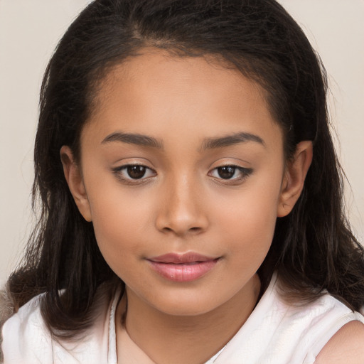 Joyful white child female with long  brown hair and brown eyes