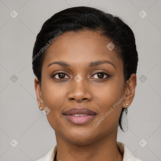 Joyful black young-adult female with short  black hair and brown eyes