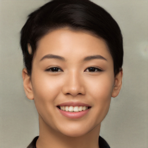 Joyful latino young-adult female with short  black hair and brown eyes