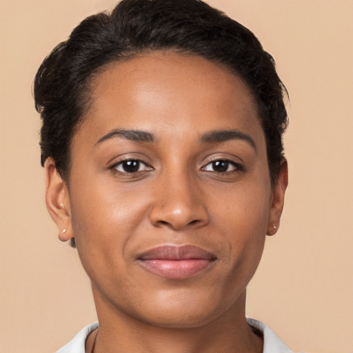 Joyful latino young-adult female with short  brown hair and brown eyes