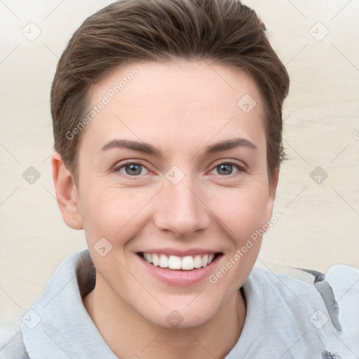 Joyful white young-adult female with short  brown hair and grey eyes