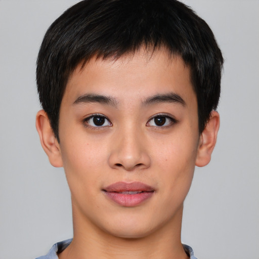 Joyful asian young-adult male with short  brown hair and brown eyes