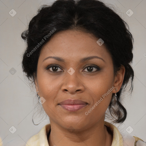 Joyful black adult female with medium  brown hair and brown eyes