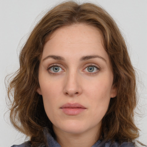 Neutral white young-adult female with long  brown hair and blue eyes