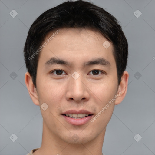 Joyful asian young-adult male with short  brown hair and brown eyes