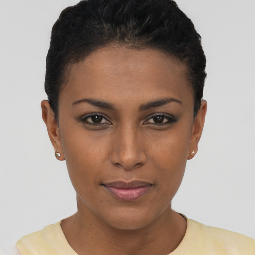 Joyful latino young-adult female with short  brown hair and brown eyes