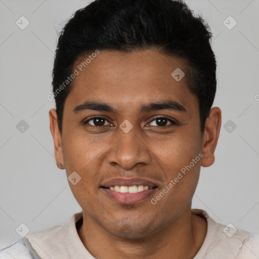 Joyful black young-adult male with short  brown hair and brown eyes