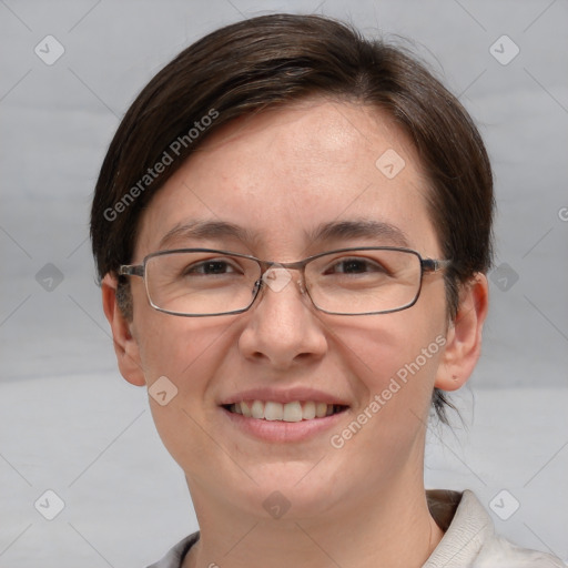 Joyful white adult female with short  brown hair and grey eyes