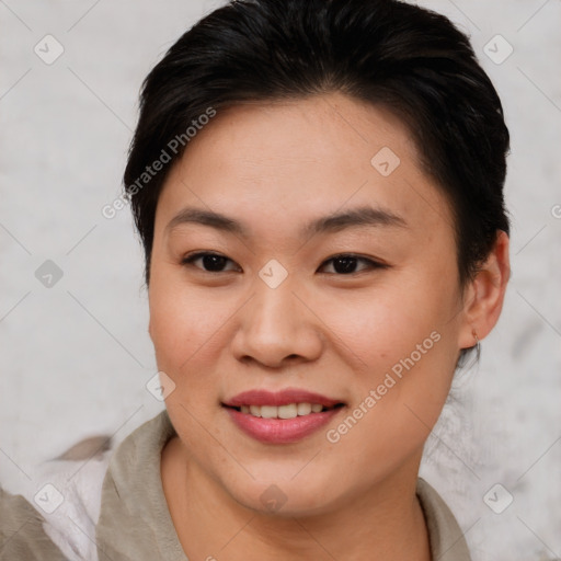 Joyful asian young-adult female with short  brown hair and brown eyes