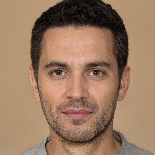 Neutral white young-adult male with short  black hair and brown eyes