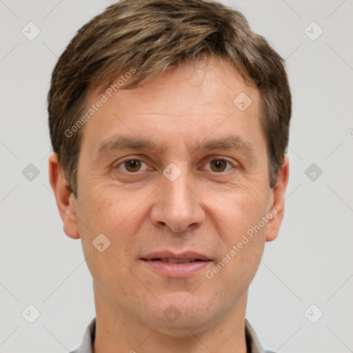 Joyful white adult male with short  brown hair and grey eyes