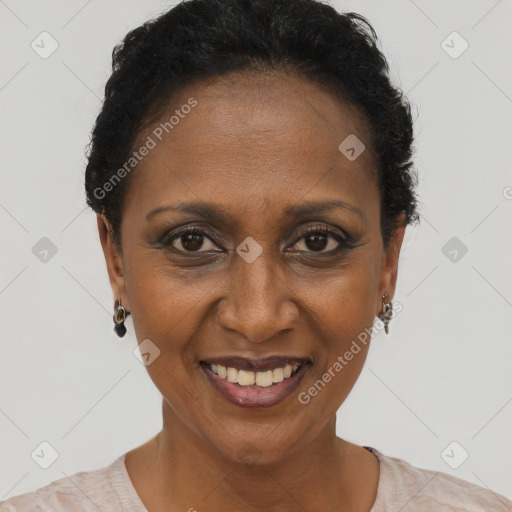 Joyful black adult female with short  brown hair and brown eyes