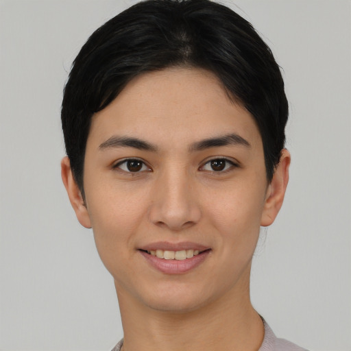 Joyful asian young-adult female with short  black hair and brown eyes