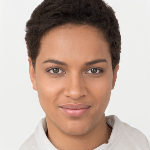 Joyful black young-adult female with short  brown hair and brown eyes