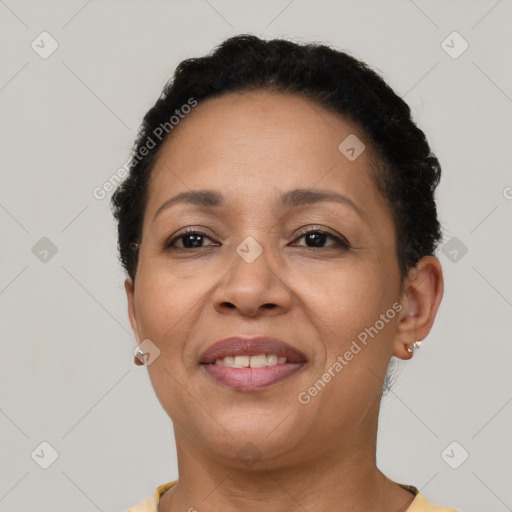 Joyful latino adult female with short  brown hair and brown eyes