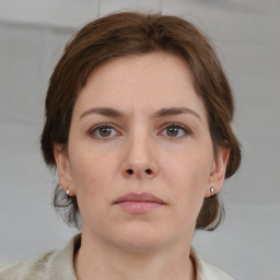 Neutral white young-adult female with medium  brown hair and grey eyes