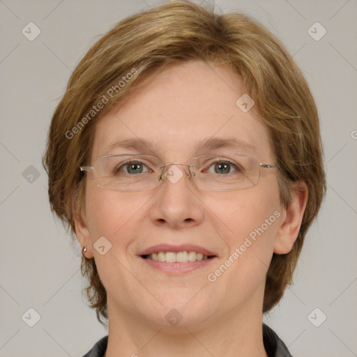 Joyful white adult female with medium  brown hair and blue eyes