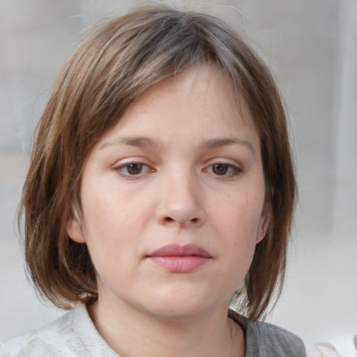 Neutral white young-adult female with medium  brown hair and grey eyes