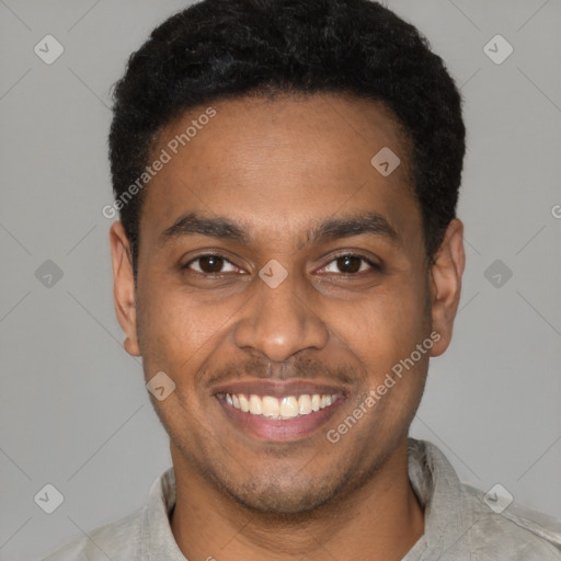 Joyful latino young-adult male with short  brown hair and brown eyes