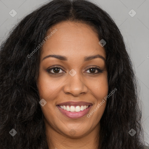 Joyful black young-adult female with long  brown hair and brown eyes