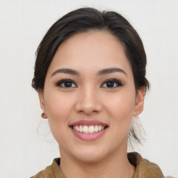 Joyful asian young-adult female with medium  brown hair and brown eyes