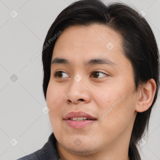 Joyful asian young-adult male with medium  brown hair and brown eyes