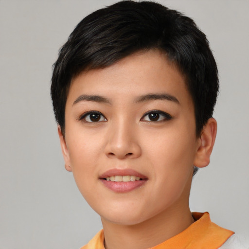 Joyful asian young-adult female with short  black hair and brown eyes
