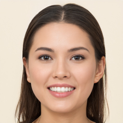 Joyful white young-adult female with long  brown hair and brown eyes