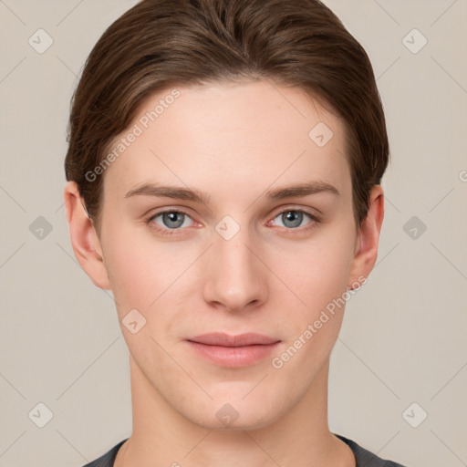 Joyful white young-adult female with short  brown hair and grey eyes