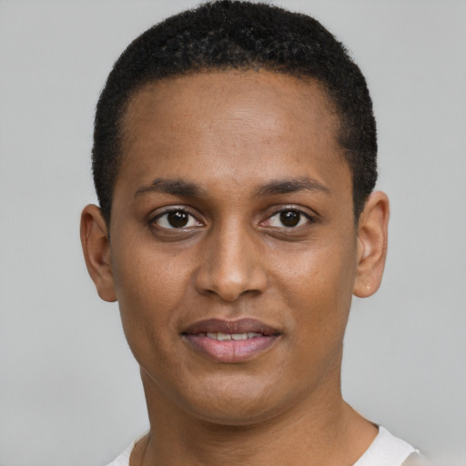 Joyful black young-adult female with short  brown hair and brown eyes