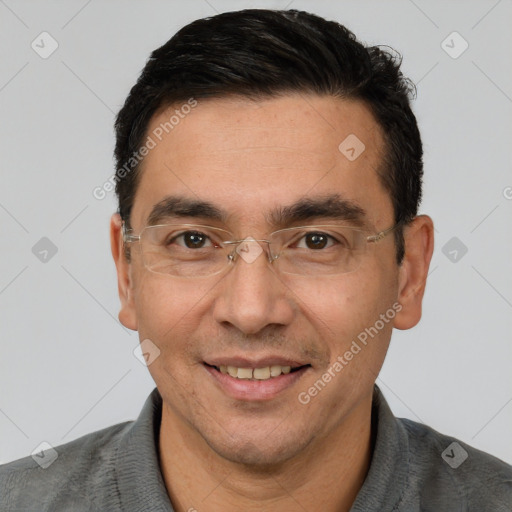 Joyful white adult male with short  black hair and brown eyes