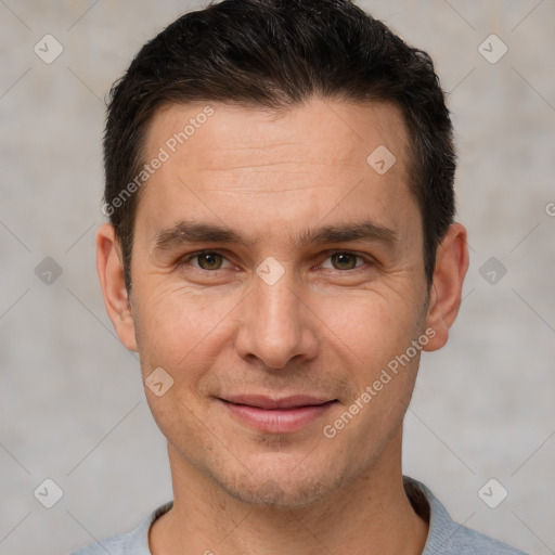 Joyful white adult male with short  brown hair and brown eyes