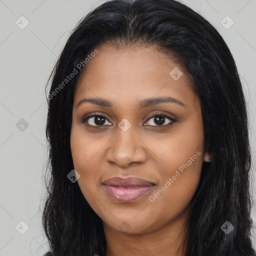 Joyful black young-adult female with long  black hair and brown eyes