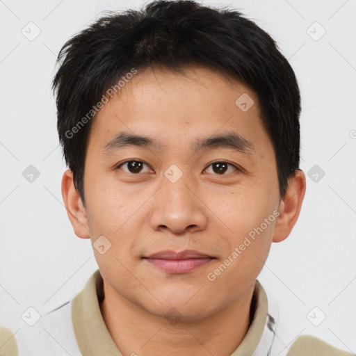 Joyful asian young-adult male with short  brown hair and brown eyes