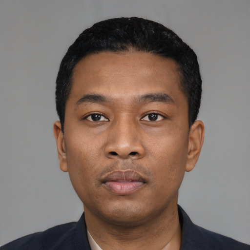 Neutral black young-adult male with short  black hair and brown eyes
