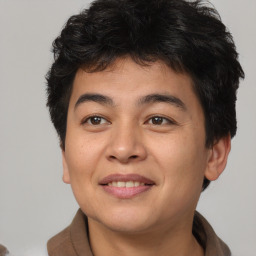 Joyful asian young-adult male with short  brown hair and brown eyes