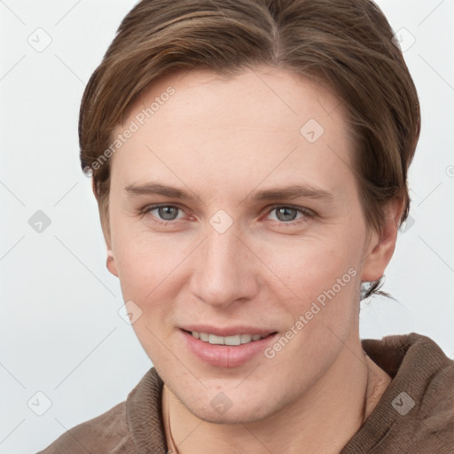 Joyful white young-adult female with short  brown hair and grey eyes