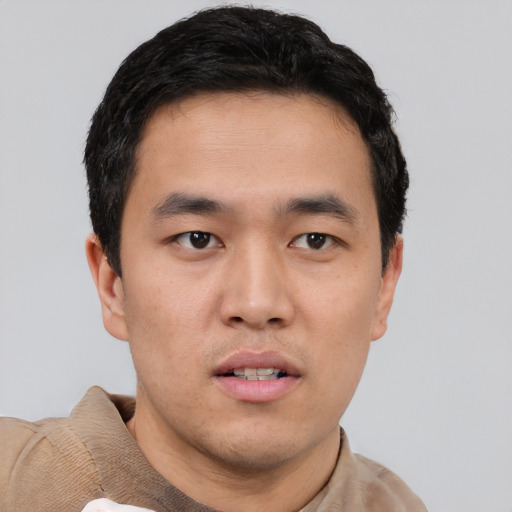 Neutral asian young-adult male with short  brown hair and brown eyes