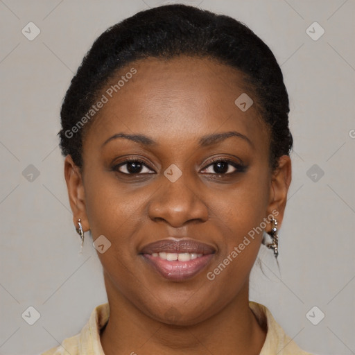 Joyful black young-adult female with short  brown hair and brown eyes