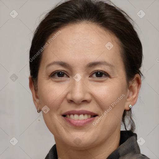 Joyful white adult female with medium  brown hair and brown eyes