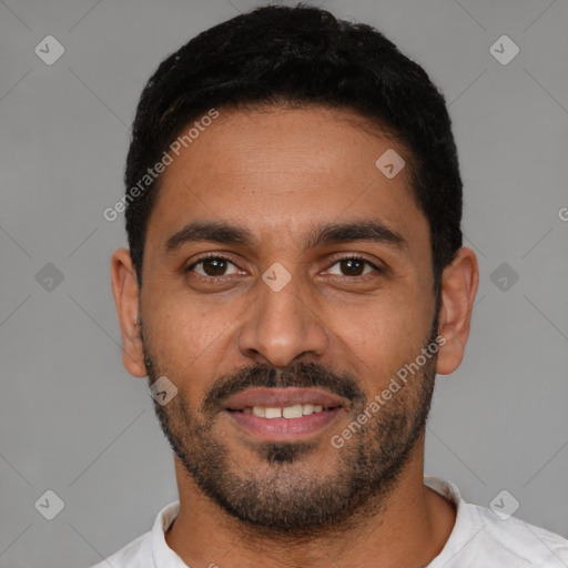 Joyful latino young-adult male with short  black hair and brown eyes