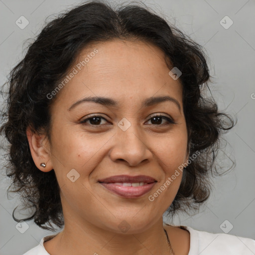 Joyful latino adult female with medium  brown hair and brown eyes